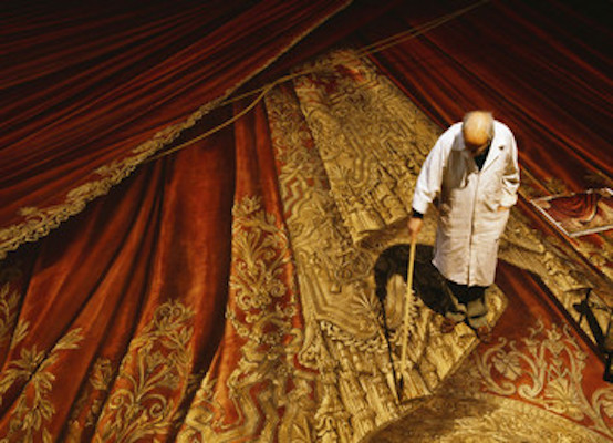 Painter painting the trompe l'oeil curtain