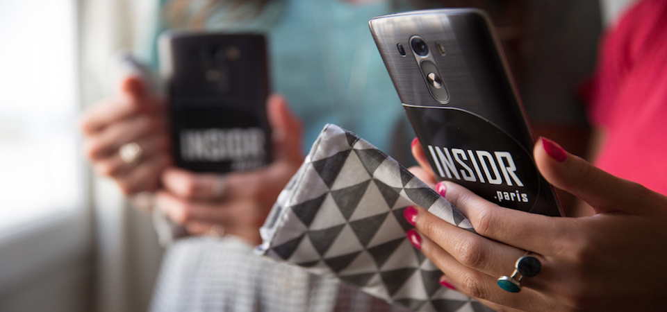 Woman holding one of INSIDR's rented smartphones