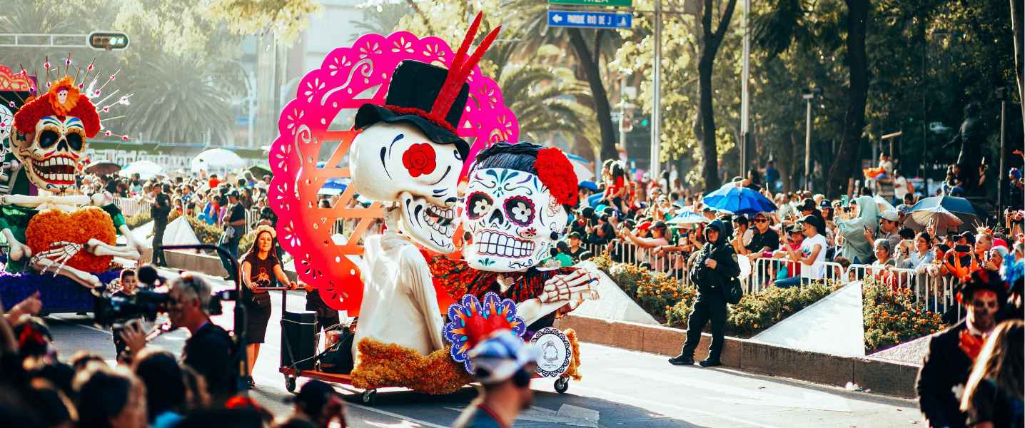 Parade with big sugar skulls